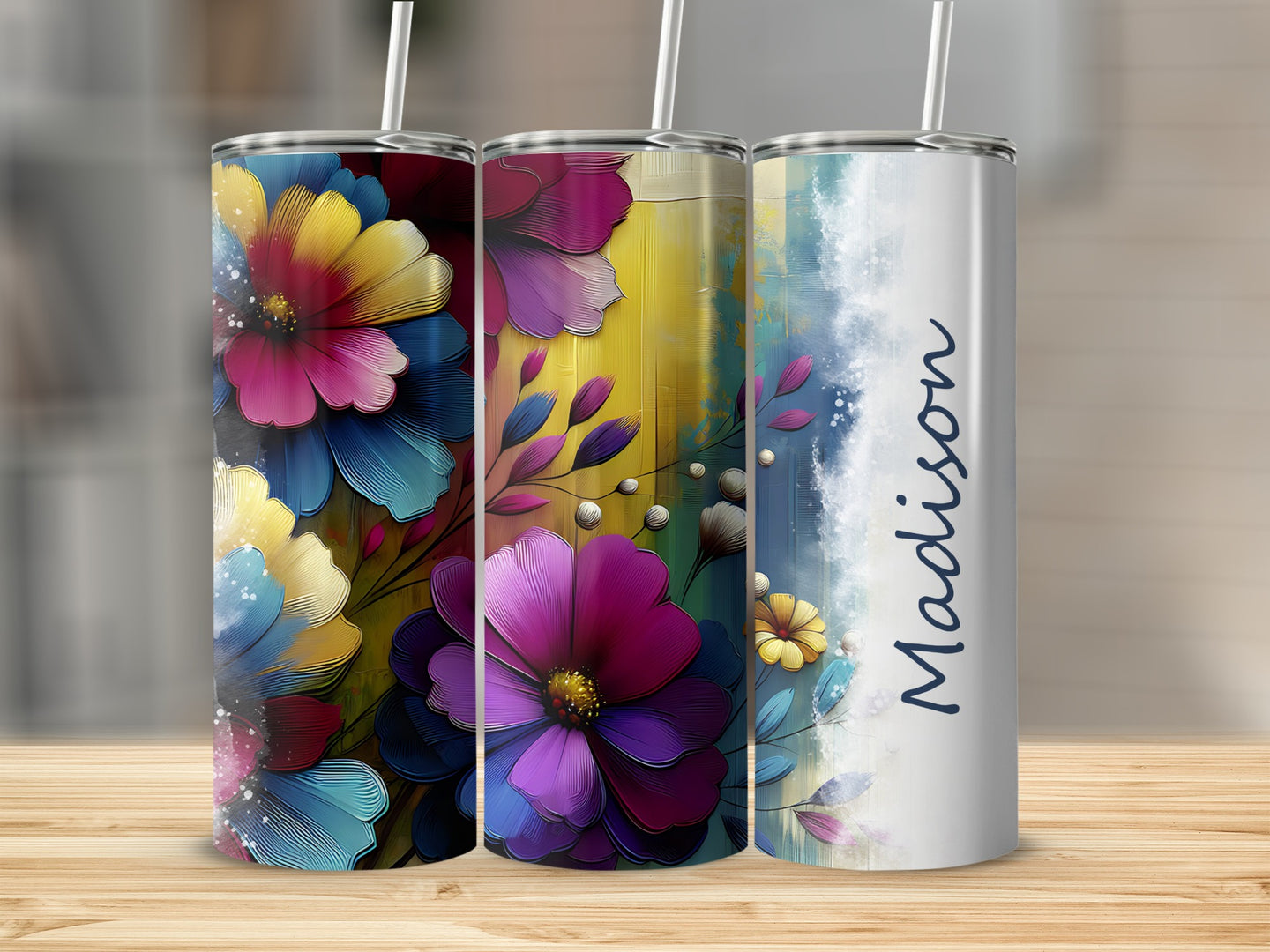 Three tumblers with floral designs and personalized name "Madison".