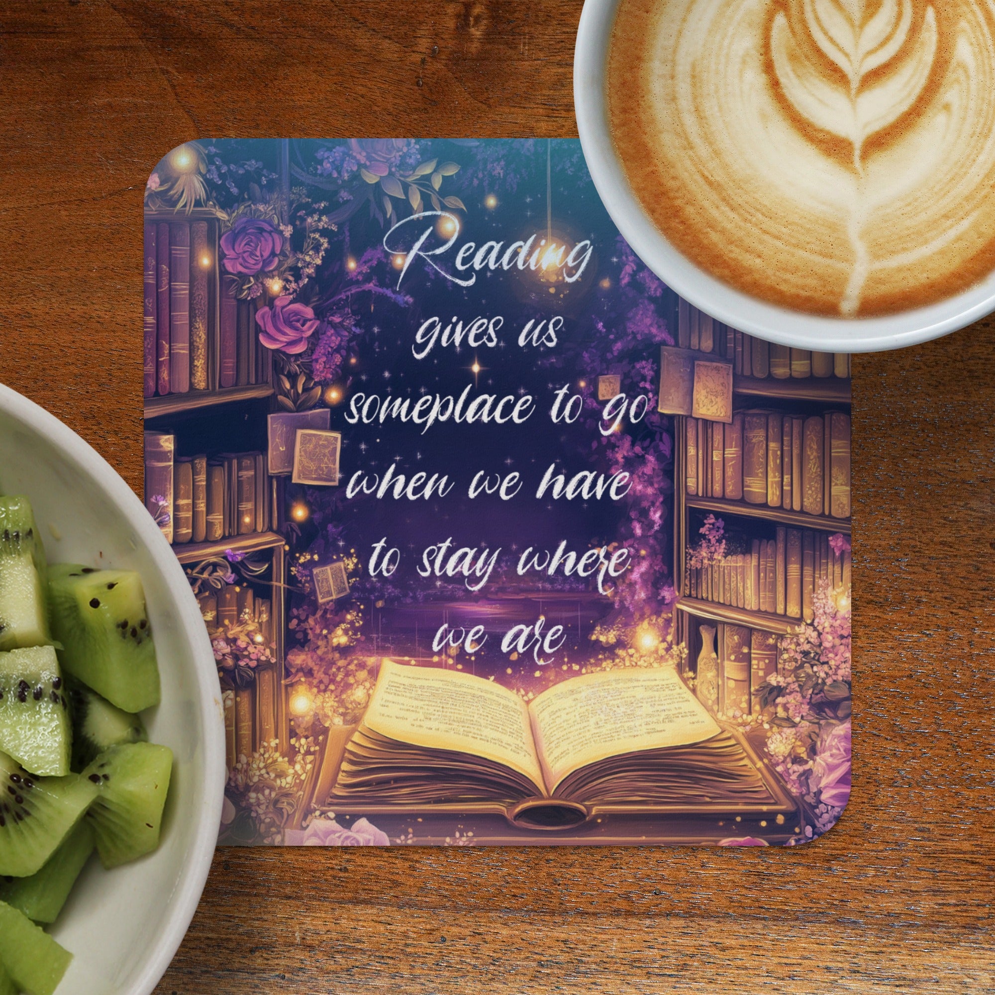 Open book with inspirational quote on a bookshelf background, with coffee and kiwi.