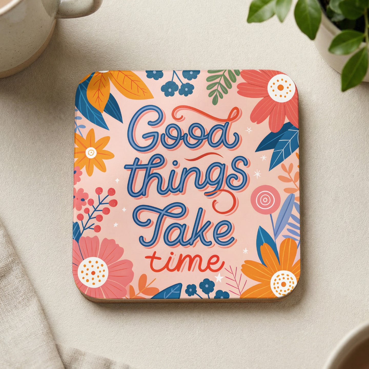 Square coaster with floral design and text "Good things Take time".