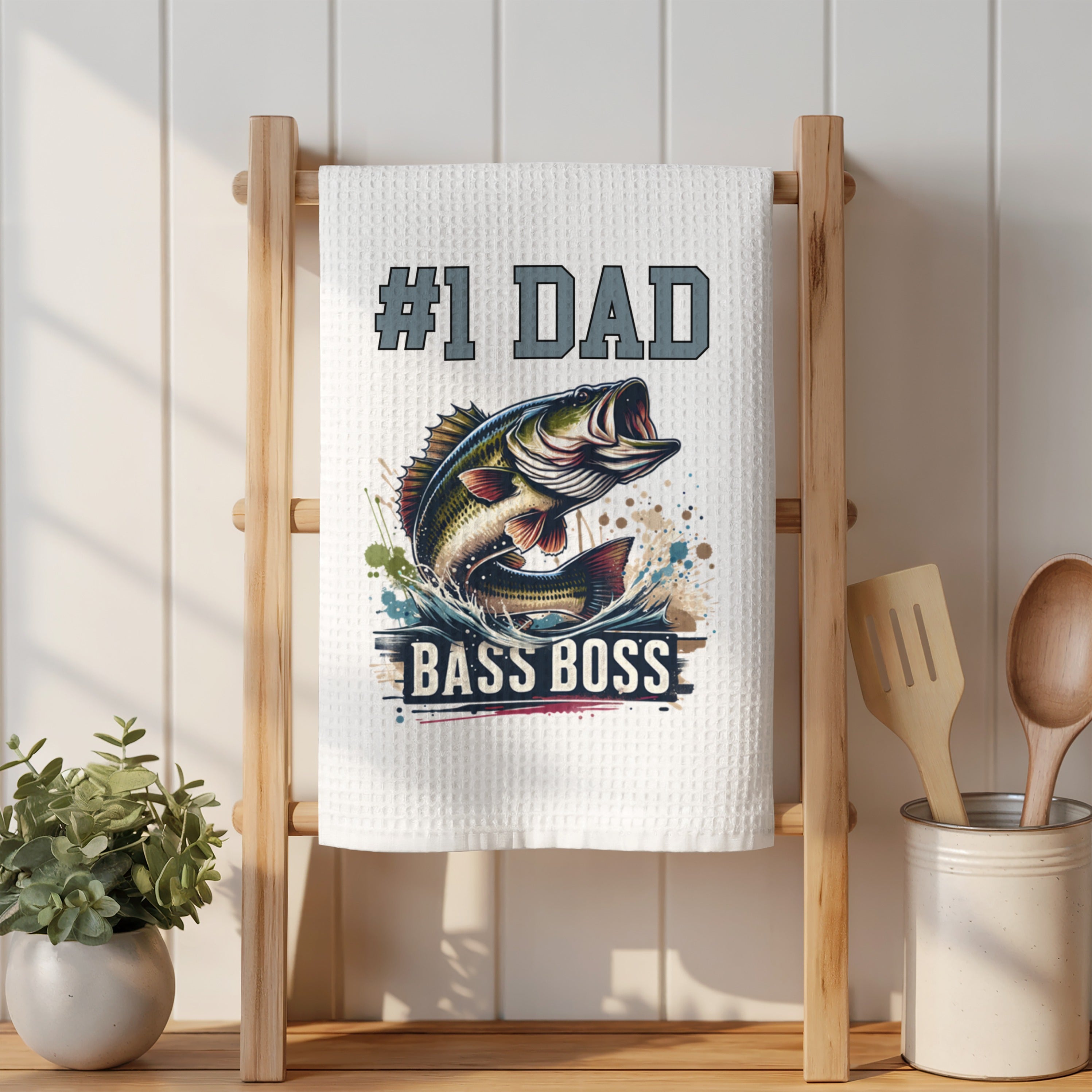 Kitchen towel with "#1 DAD BASS BOSS" text and a jumping bass graphic.