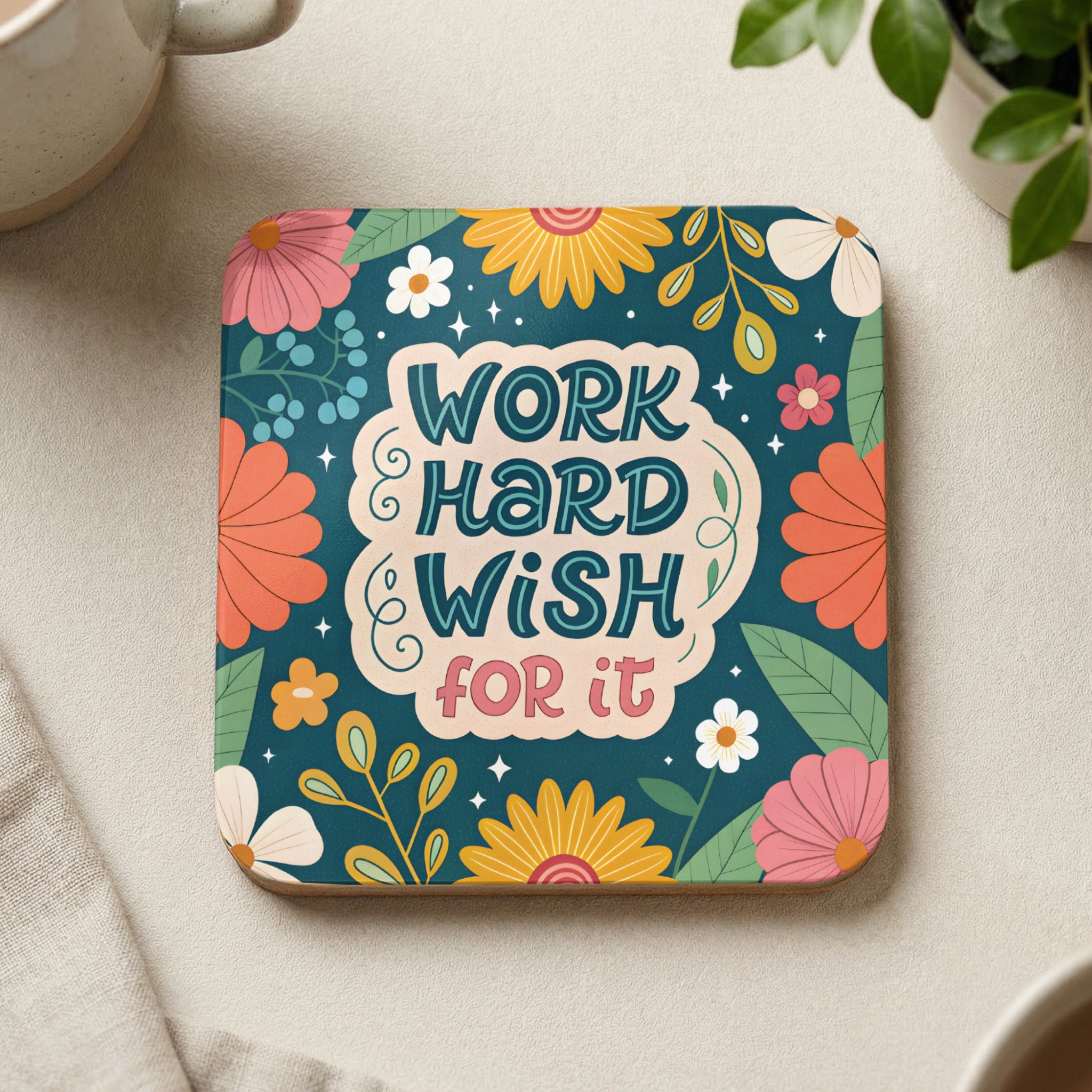 Square coaster with floral design and "Work hard, wish for it" text.