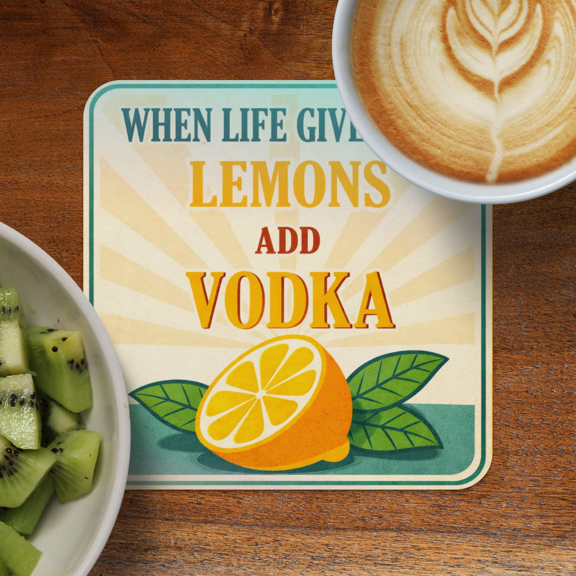 Coaster with lemons, leaves, and text "When life gives lemons add vodka".