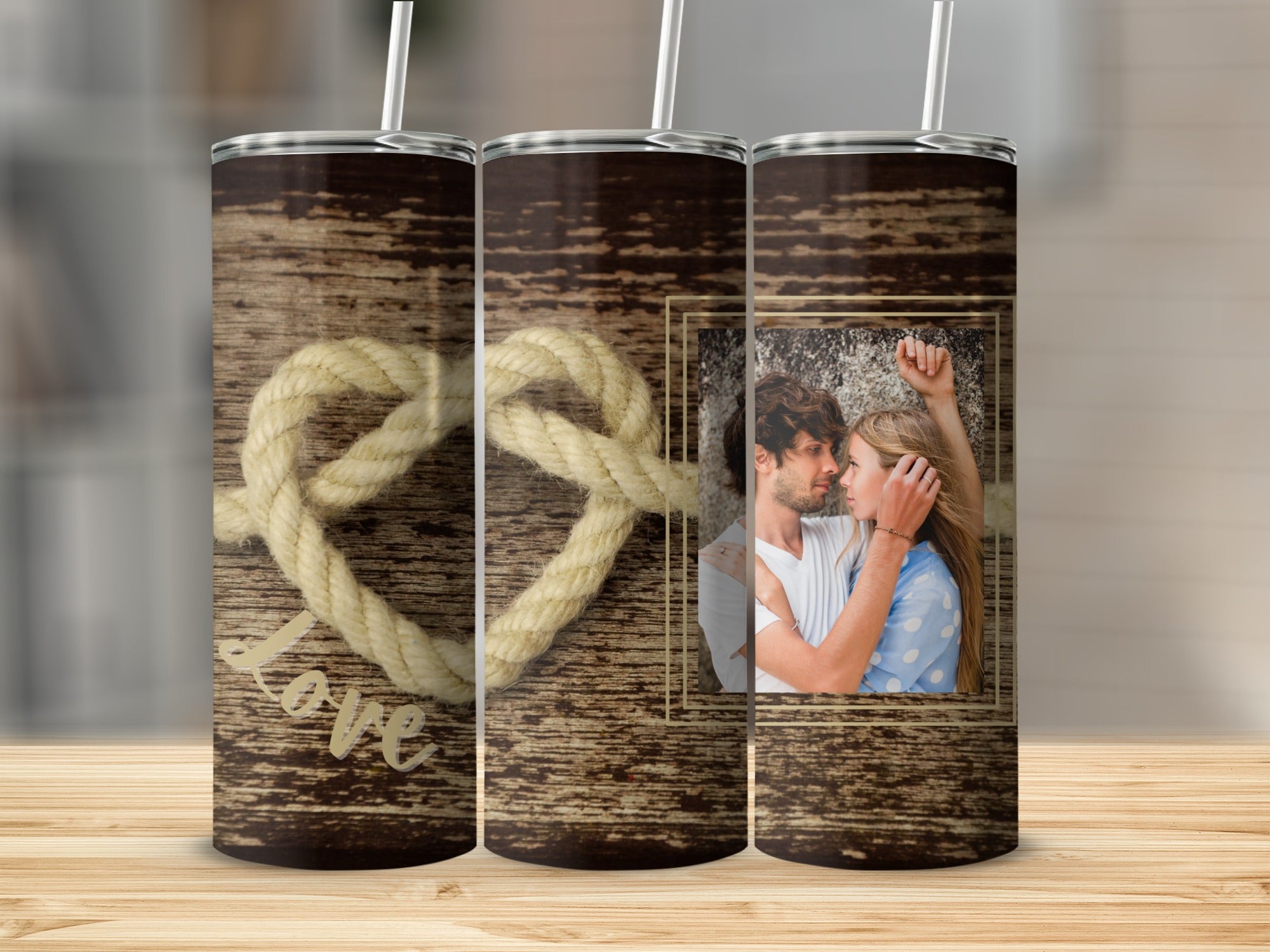 Tumbler with wooden background, rope heart, and couple photo.