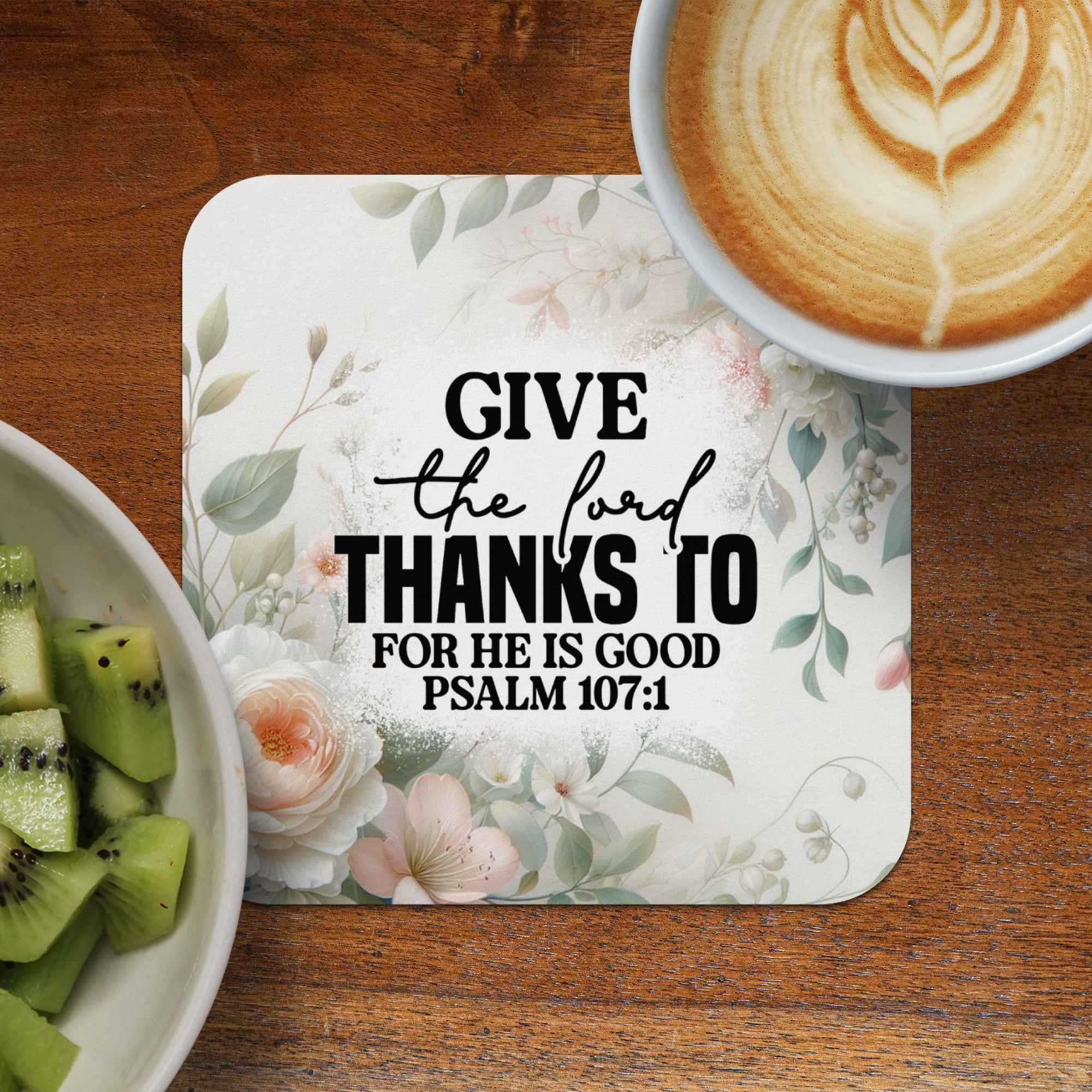 Coaster with text "GIVE the lord THANKS TO FOR HE IS GOOD PSALM 107:1" and floral accents.