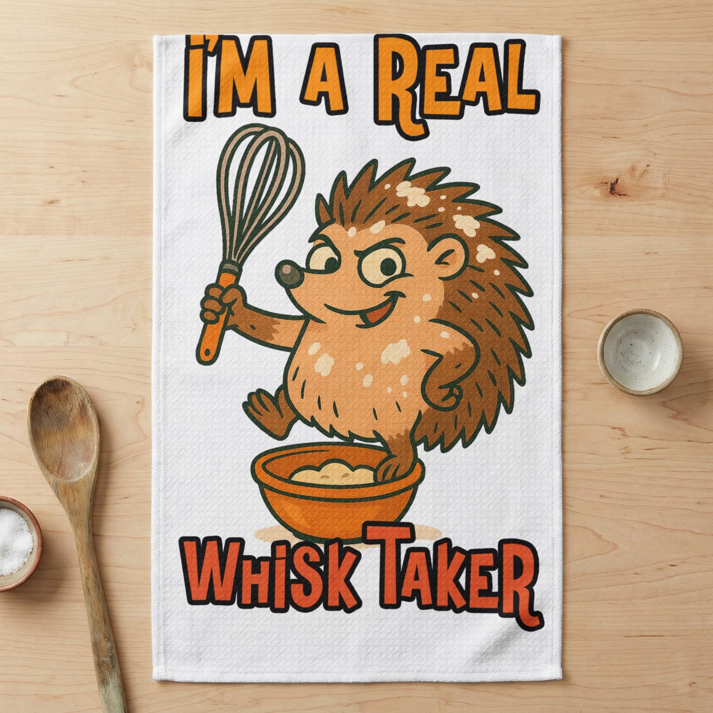 Cartoon hedgehog holding whisk over bowl, text reads "I'm a real Whisk Taker".