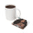 Mug of coffee next to a square coaster with "ENTREPRENEUR MODE ON OFF" text and a tattooed woman.