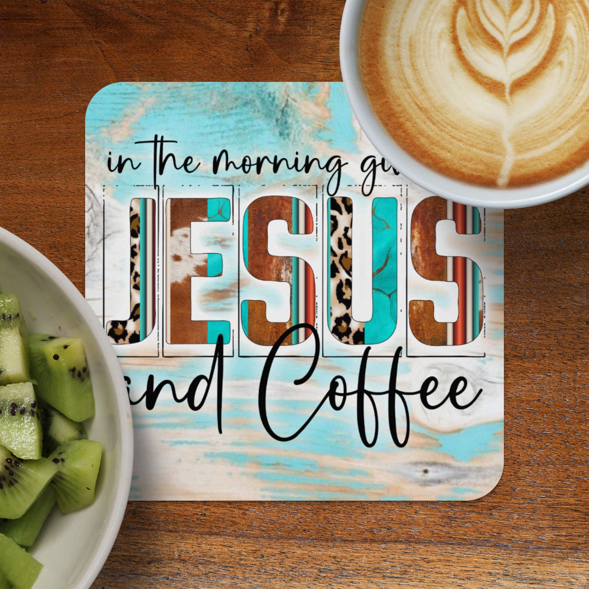 Jesus and Coffee text with leopard and teal wood background.