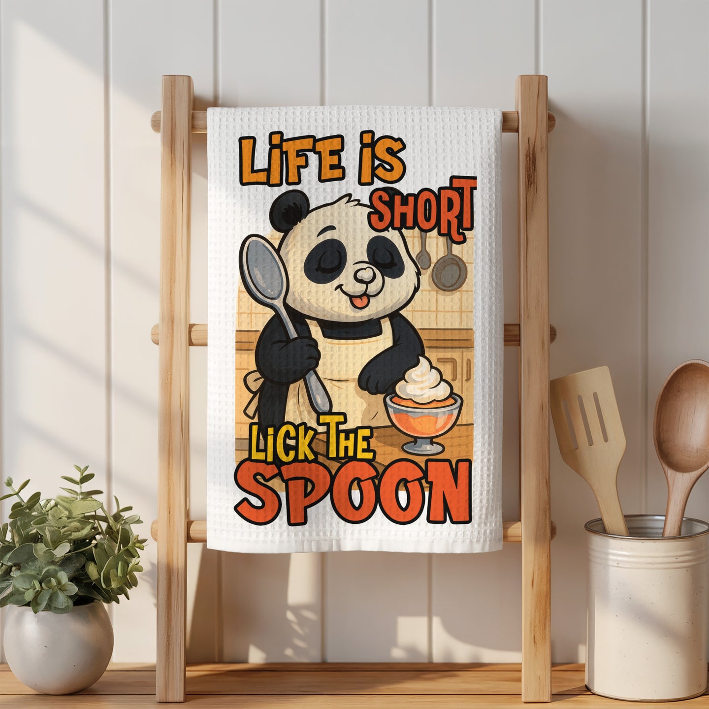Panda wearing apron, holding spoon, with "Life is short lick the spoon" text.