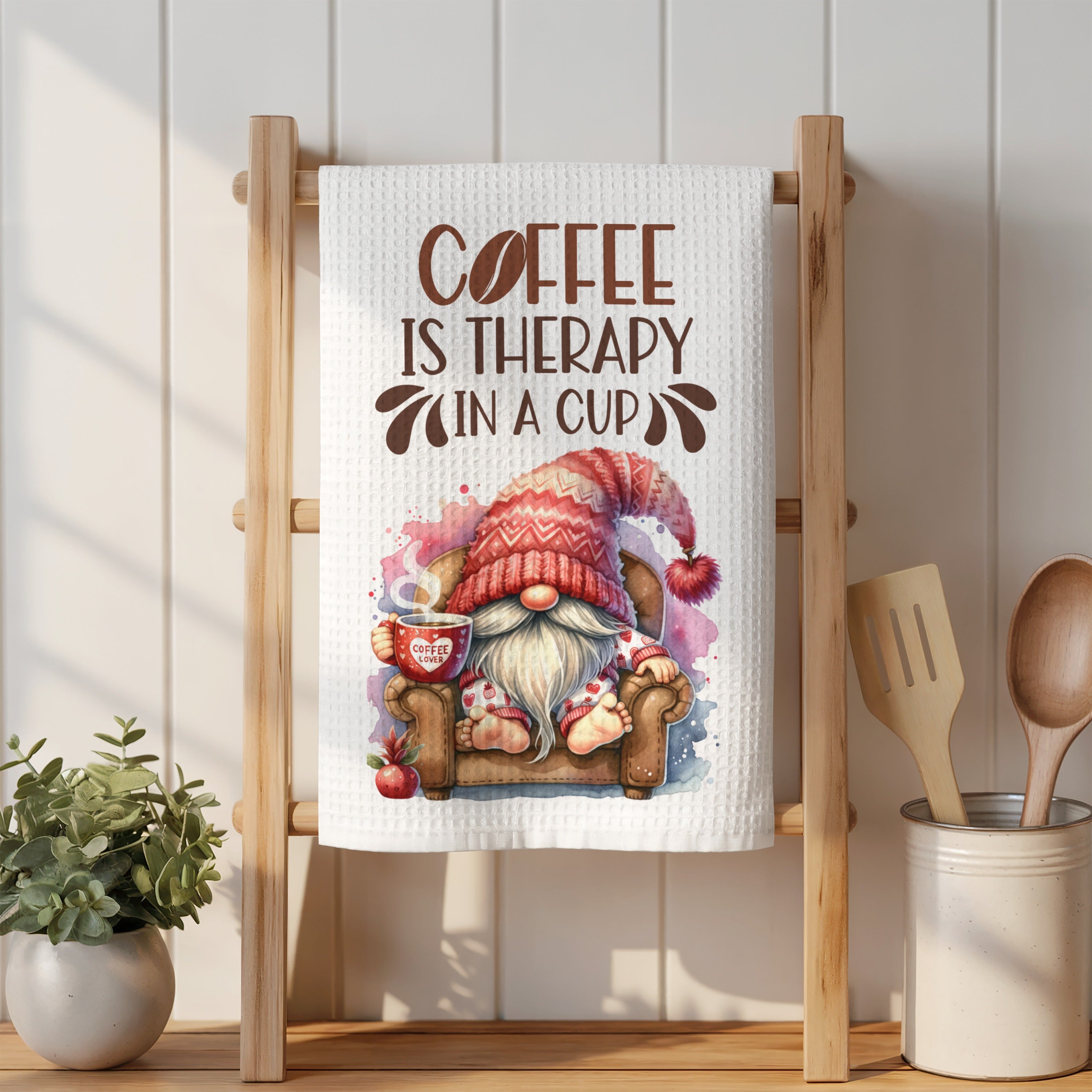 Gnome with coffee cup sits on sofa, text "COFFEE IS THERAPY IN A CUP".
