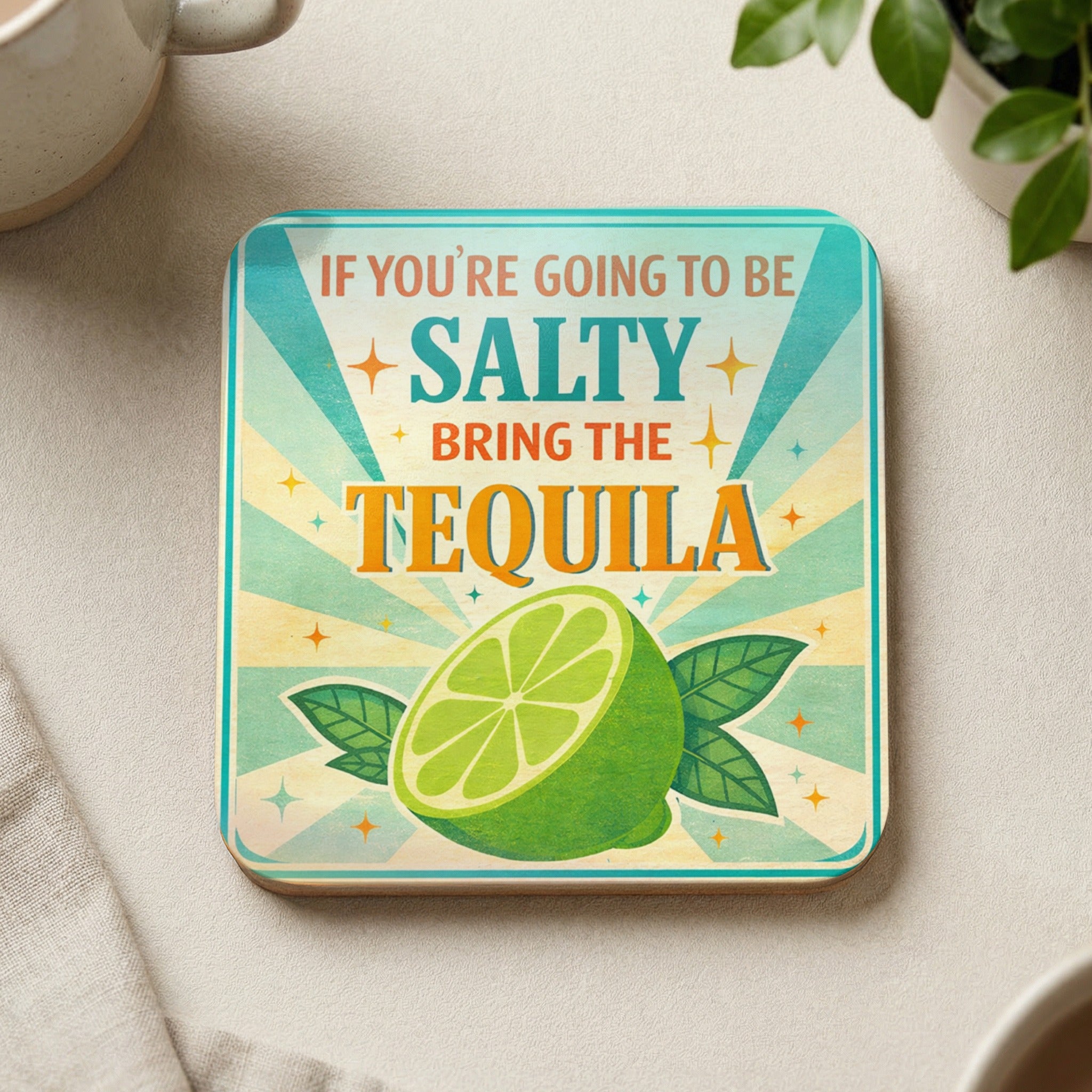 Coaster with "If you're going to be salty, bring the tequila" text and a lime.