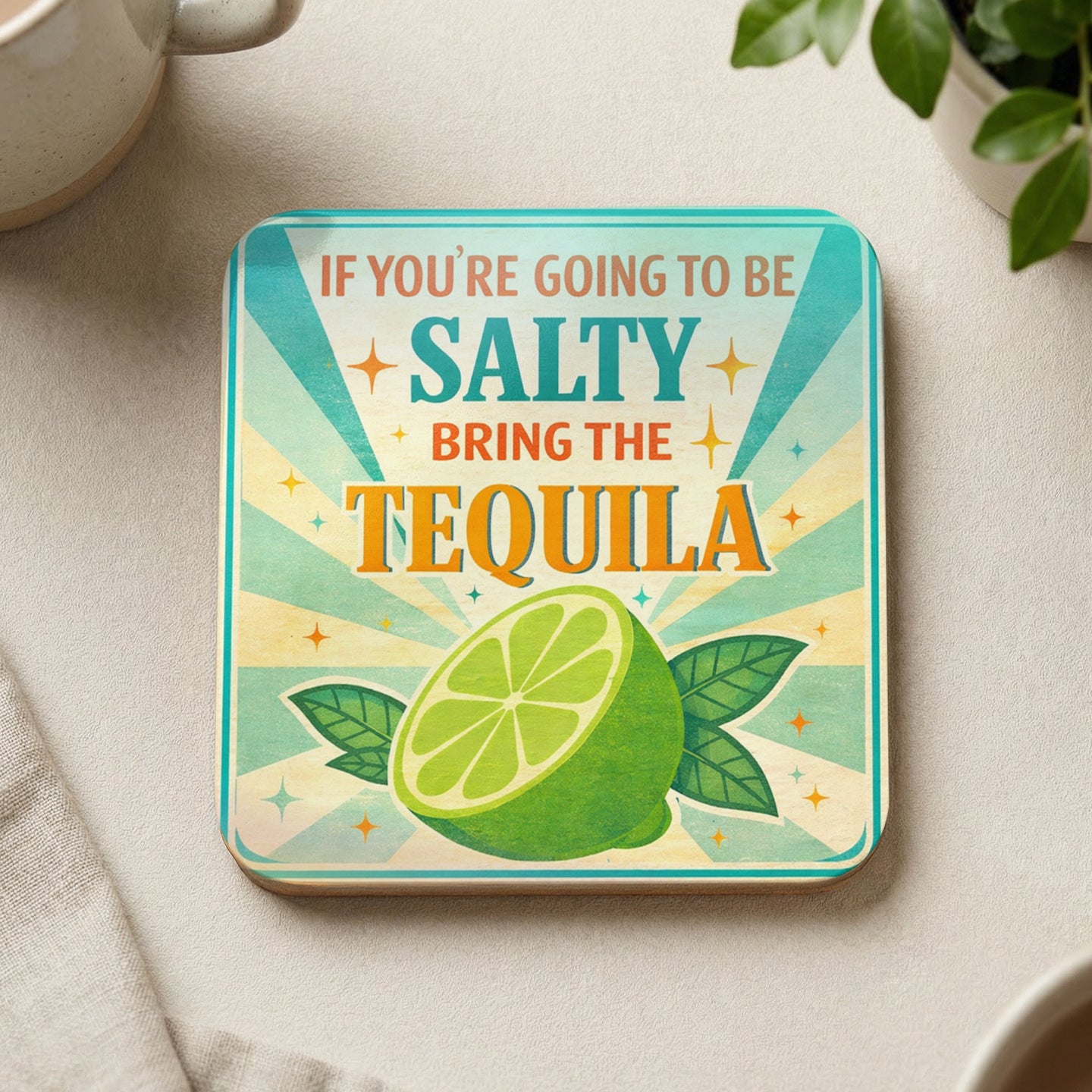 Coaster with "If you're going to be salty, bring the tequila" text and a lime.