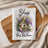Kitchen towel with birdhouse, flowers, and "Bless this kitchen" text.