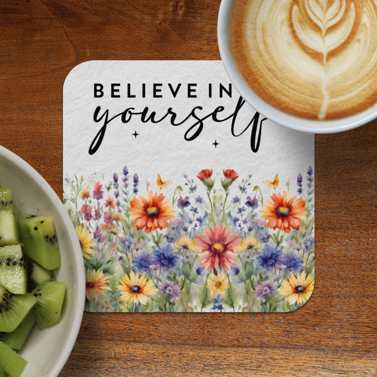Coaster with "Believe in yourself" text and watercolor wildflowers.