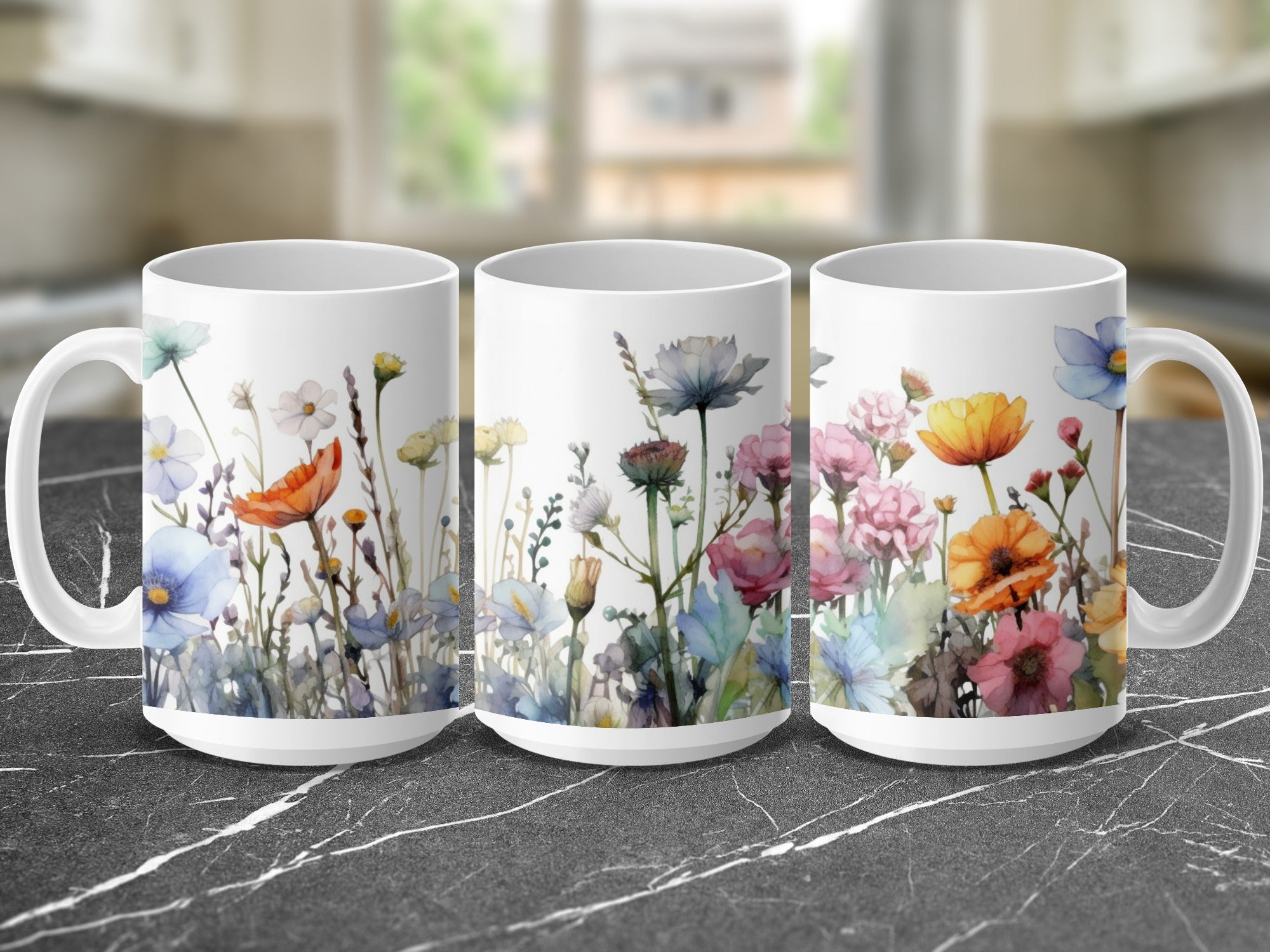 White mugs with floral watercolor designs and blurred kitchen background.