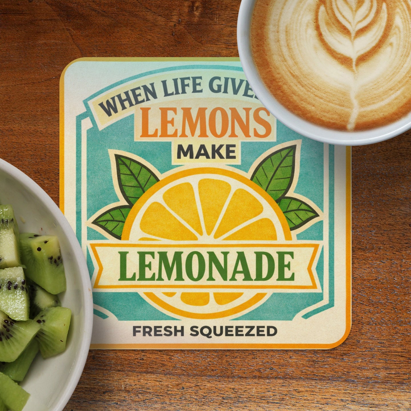 Coaster with "When life gives lemons make lemonade" text and a lemon graphic.