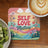 Coaster with "Self Love Matters" text, floral and cloud design, next to kiwi and coffee.