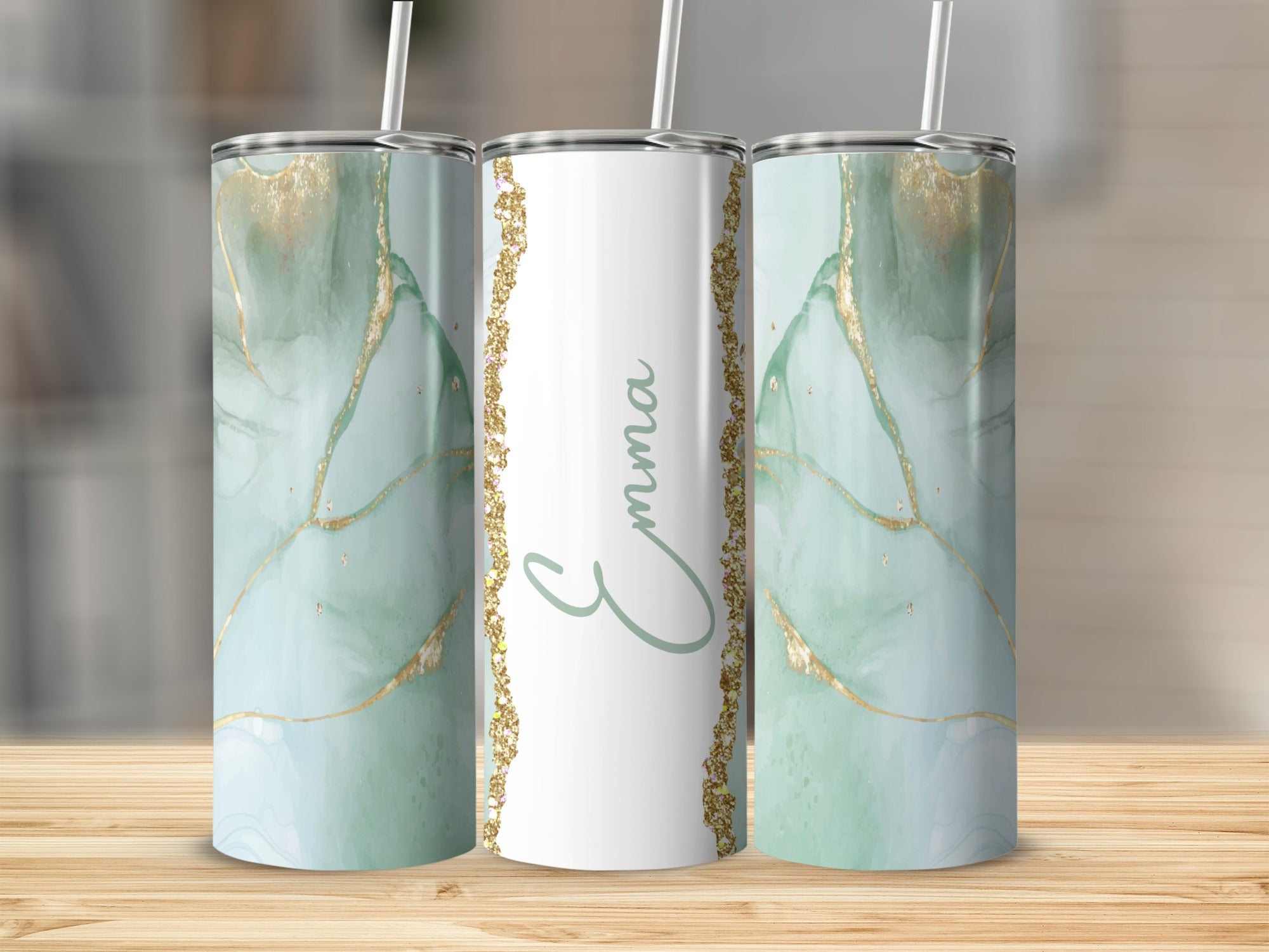 Personalized tumbler with marbled green and gold design and "Emma" text.